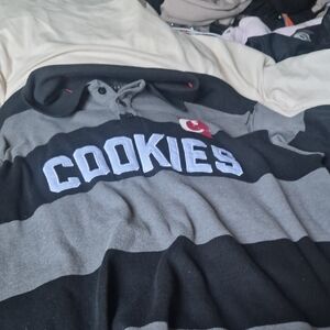 Cookies Men’s Black and Gray Striped Polo Sweater